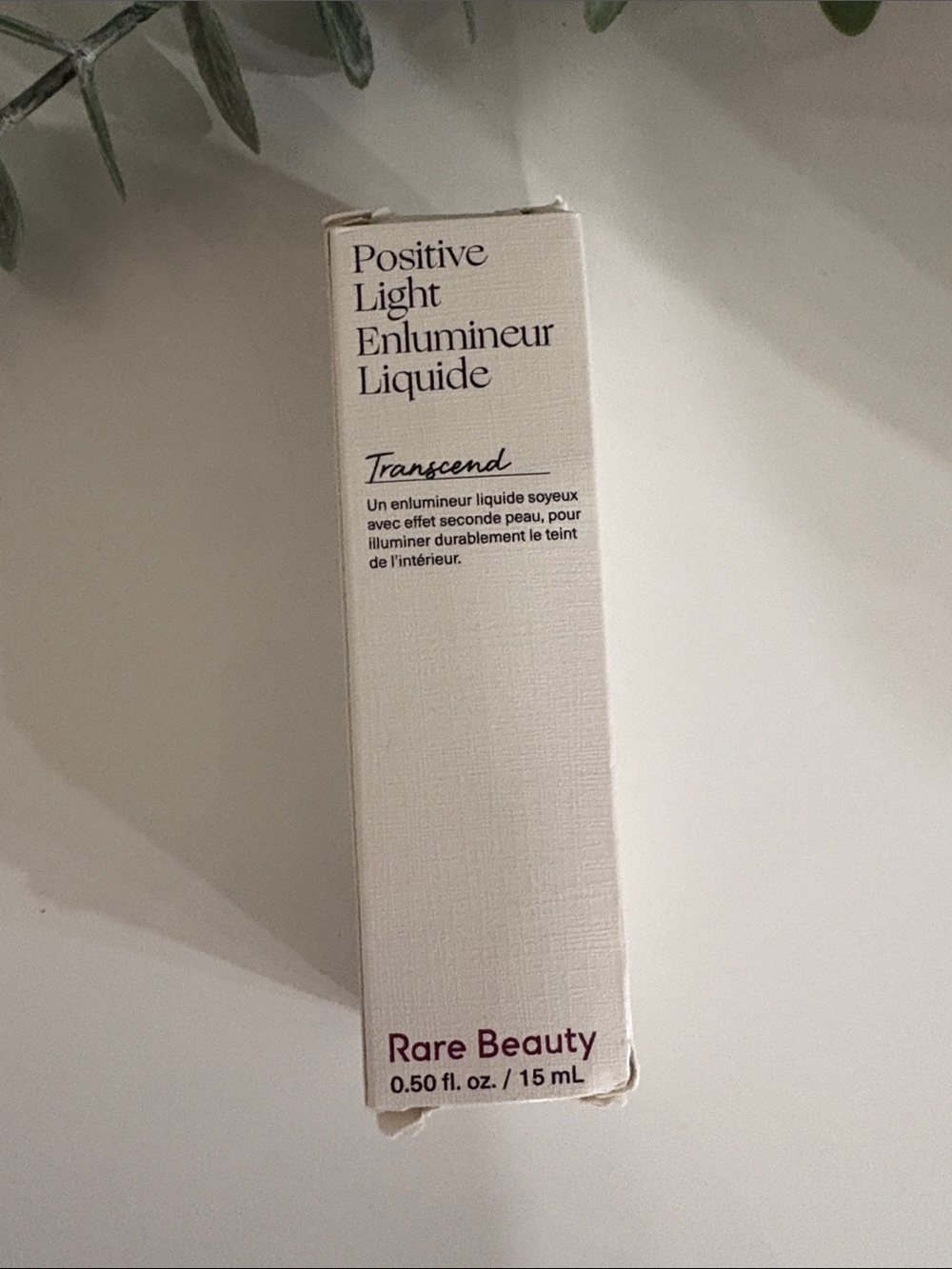 Rare Beauty Positive Light Liquid Highlighter - Transcend - White and Plum Text